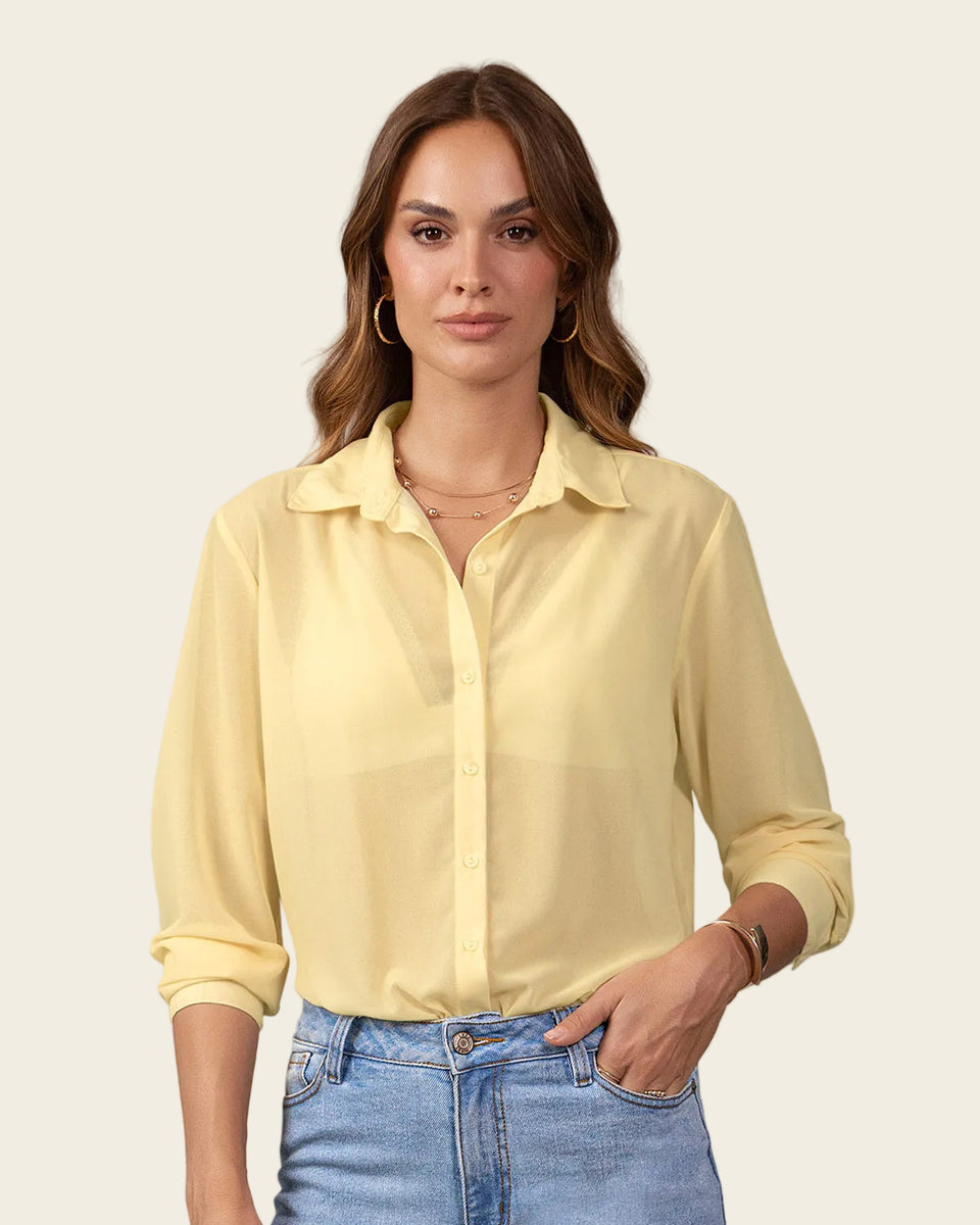 Blusa manga larga elaborada en tela con transparencia