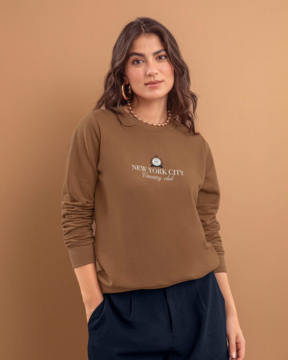 Suéter manga larga con estampado localizado de cuello redondo