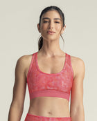 Top deportivo con espalda atlética en material de secado rápido#color_040-estampado-rosado-degrade