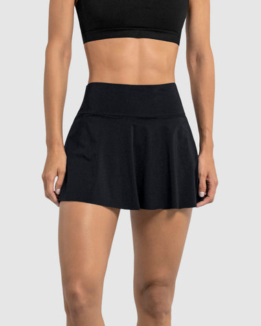 Enagua deportiva con short interno con bolsillo#color_700-negro