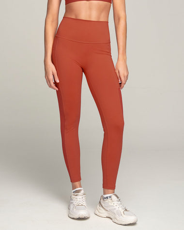 Legging deportivo con bolsillo lateral y detalles en tul#color_336-rojo-canela