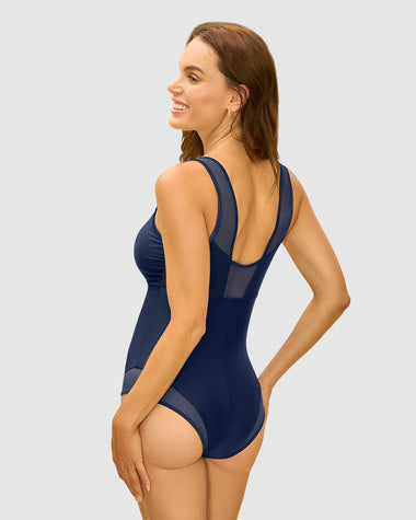Traje de baño entero con detalles en tul en escote y piernas#color_509-azul-oscuro