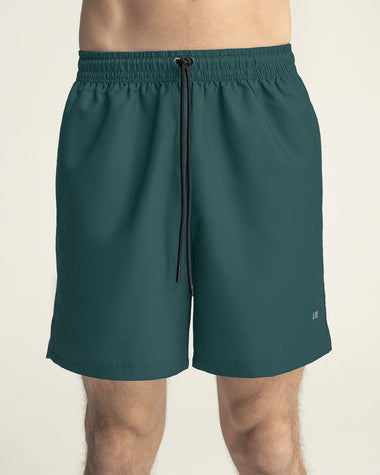 Pantaloneta deportiva con bolsillos funcionales#color_678-verde