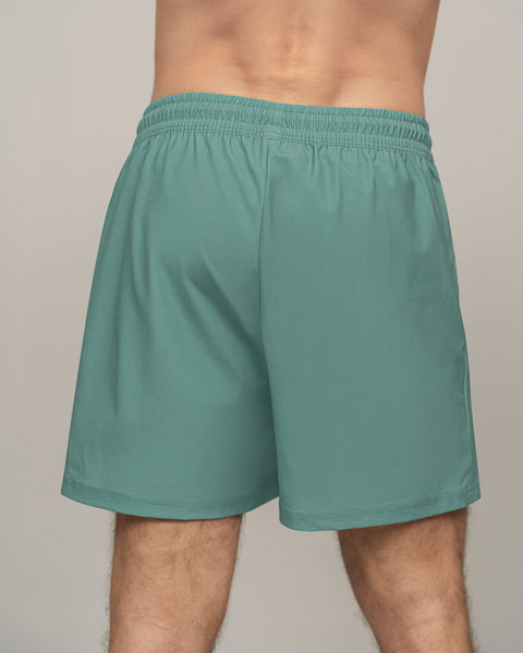 pantaloneta-deportiva-con-bolsillo-lateral-con-boxer-interno#color_644-verde