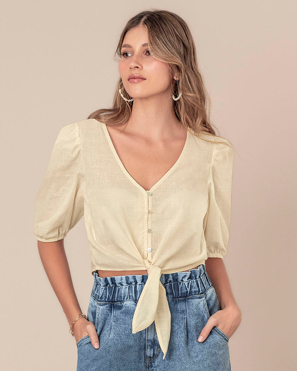 Blusa manga corta tipo crop con detalle de anudado en frente