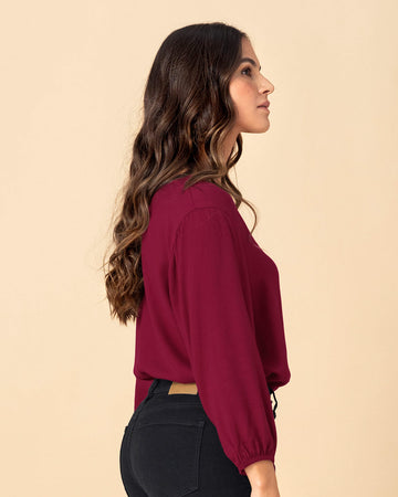 Blusa manga larga con elástico para efecto volumen#color_c33-vino