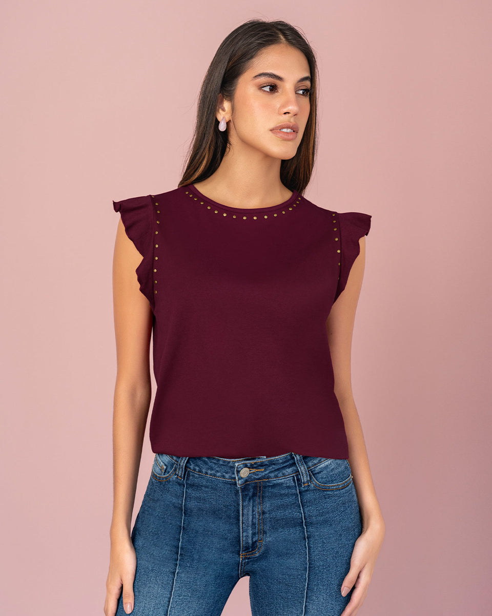 Blusa con taches en cuello y sisa