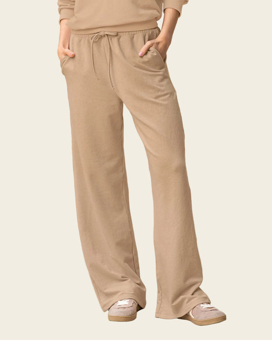 Pantalón ruedo amplio con elástico y tira anudable en cintura#color_c54-arena