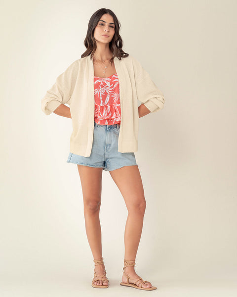 Blusa tiritas con escote en V y boleros en ruedo#color_104-fondo-coral