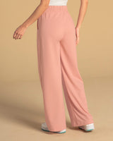 Pantalón tipo jogger con ruedo ancho#color_180-palo-rosa