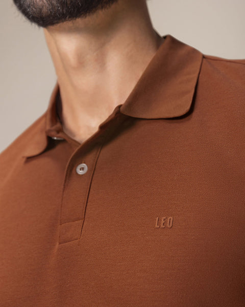 Camiseta tipo polo manga larga con logo bordado en frente#color_174-rojo-ladrillo