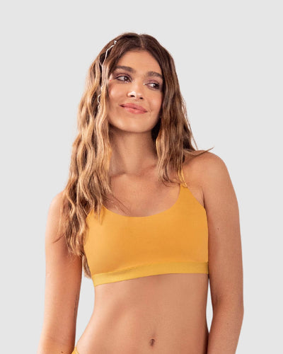 Top liviano ultrasuave con tiras cruzadas elaborado en pet reciclado#color_113-amarillo