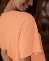 Blusa oversized manga corta cuello redondo#color_315-mandarina